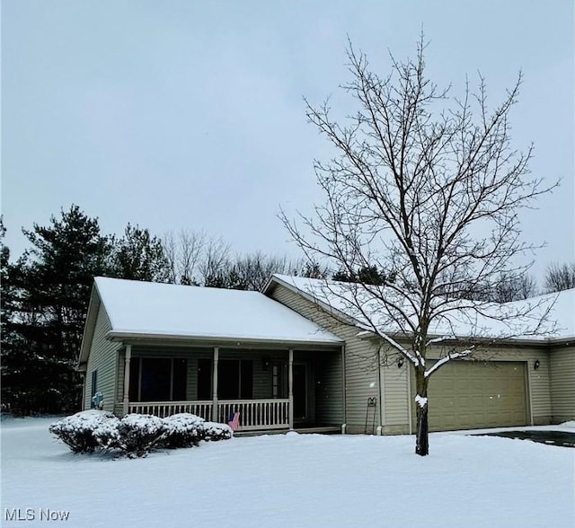 view of front of property with a garage and covered porch