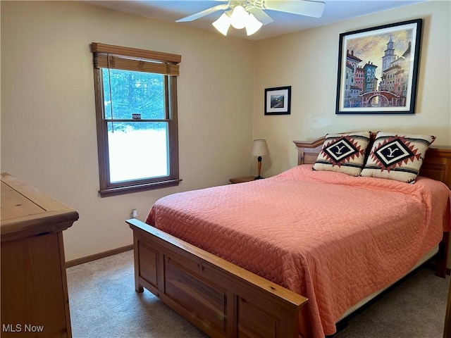 bedroom with light colored carpet and ceiling fan