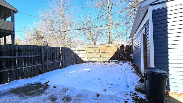 view of yard covered in snow