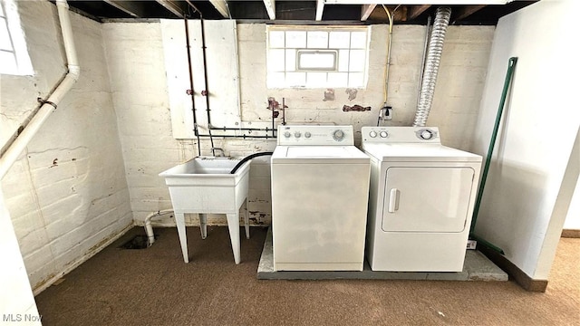 laundry area with washing machine and dryer and carpet flooring