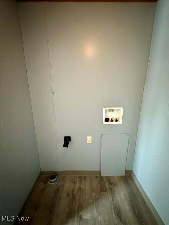 laundry area with hardwood / wood-style floors and washer hookup