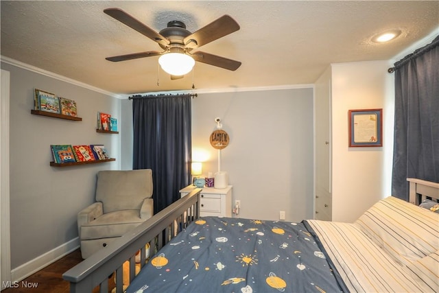 bedroom with crown molding, dark hardwood / wood-style flooring, a textured ceiling, and ceiling fan