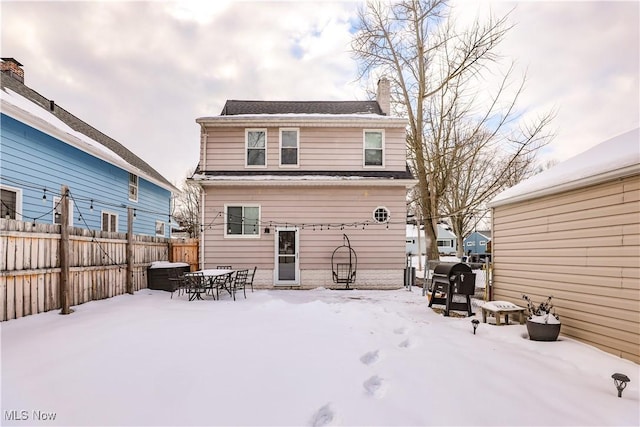 view of snow covered house