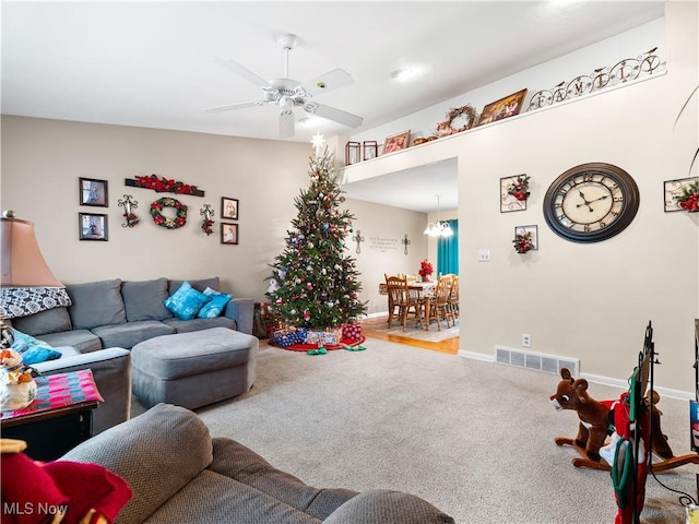 carpeted living room featuring ceiling fan