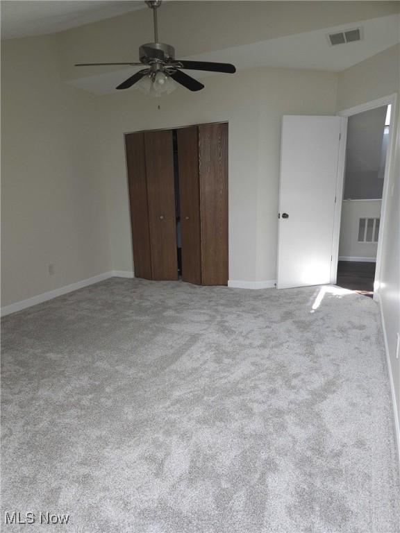 unfurnished bedroom featuring carpet flooring and ceiling fan