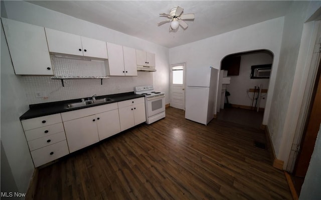 kitchen with sink, white appliances, dark hardwood / wood-style floors, ceiling fan, and white cabinets