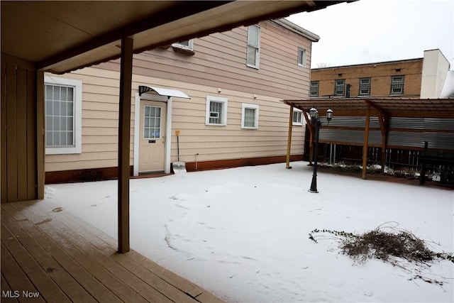 view of snow covered deck