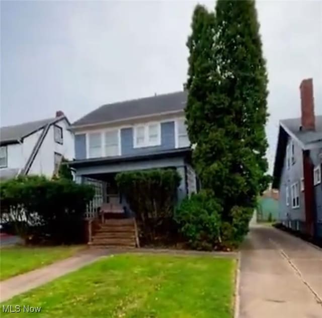 view of front of home with a front yard