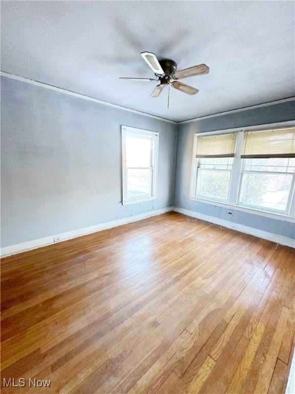 unfurnished room with ceiling fan and light wood-type flooring