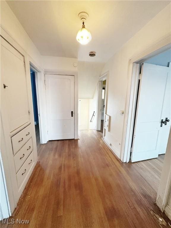 hall with hardwood / wood-style floors