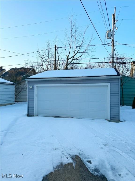 view of snow covered garage