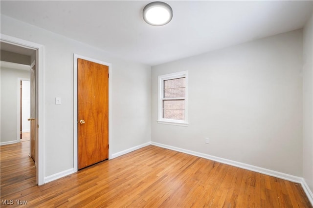 unfurnished bedroom with light wood-type flooring