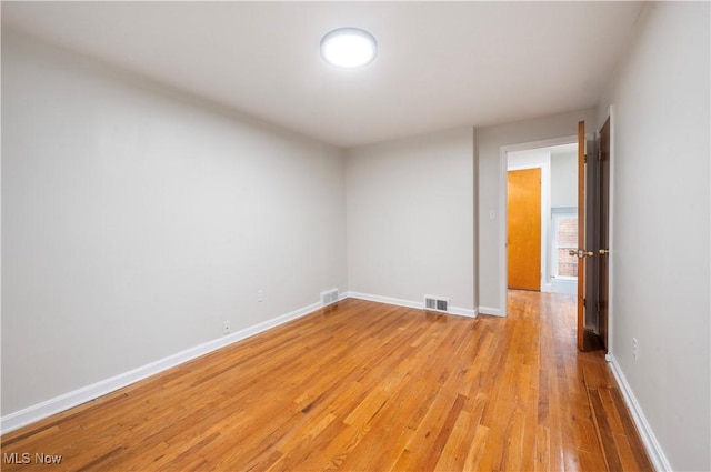 unfurnished room with light hardwood / wood-style flooring