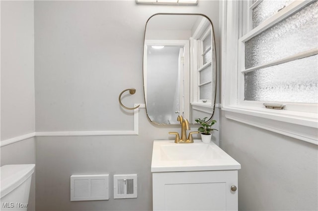 bathroom with vanity and toilet