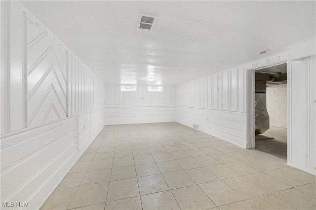 unfurnished room with light tile patterned floors