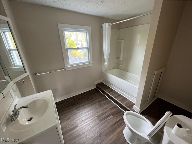 bathroom with shower / bath combination with curtain, vanity, and hardwood / wood-style floors