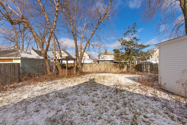 view of yard covered in snow