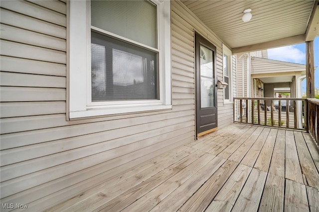 wooden terrace featuring a porch