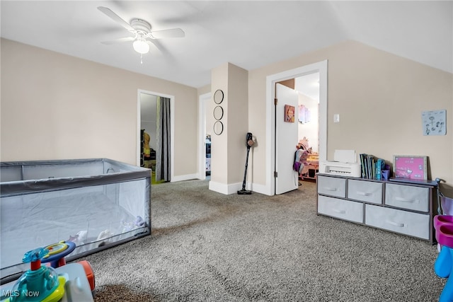 recreation room with a ceiling fan, carpet flooring, vaulted ceiling, and baseboards