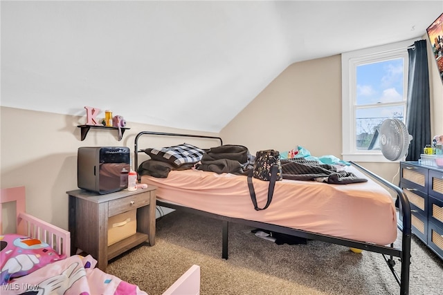 bedroom featuring carpet flooring and vaulted ceiling