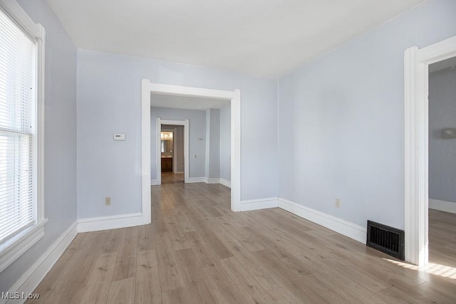 spare room with light hardwood / wood-style floors