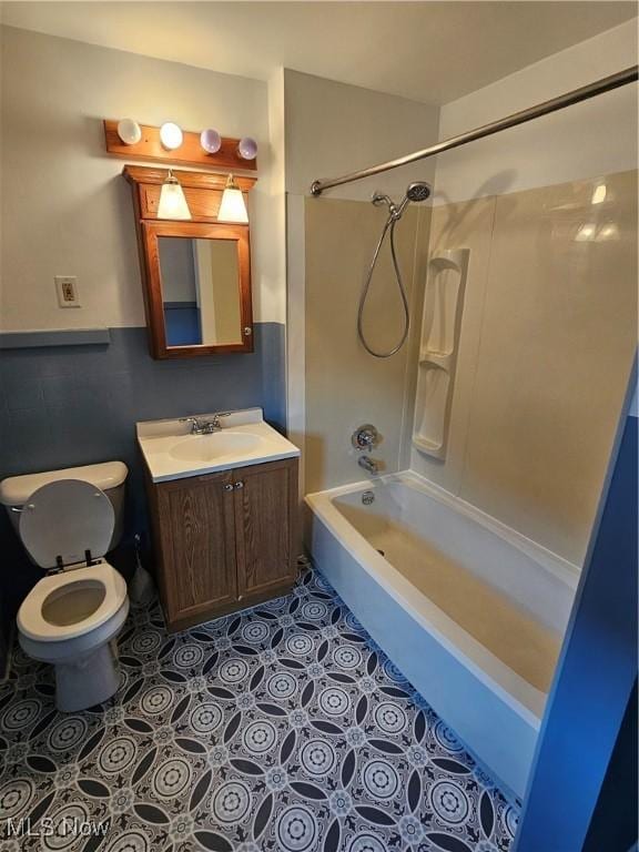 full bathroom featuring vanity, shower / washtub combination, and toilet