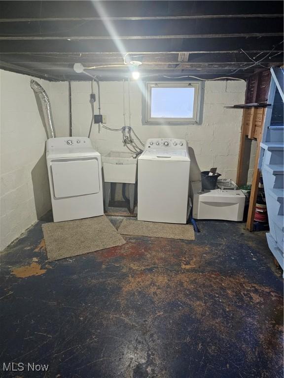 laundry room featuring sink and washing machine and clothes dryer