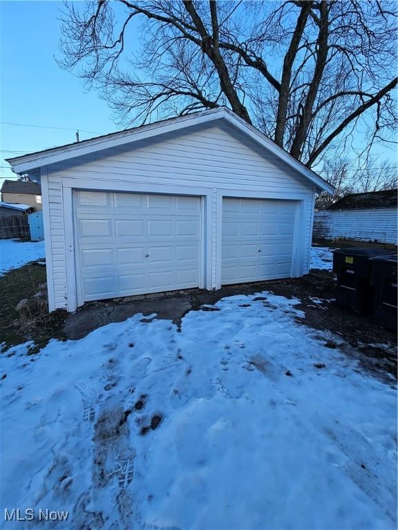 view of snow covered garage