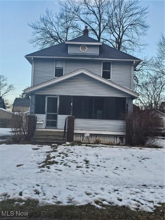 front facade featuring a sunroom