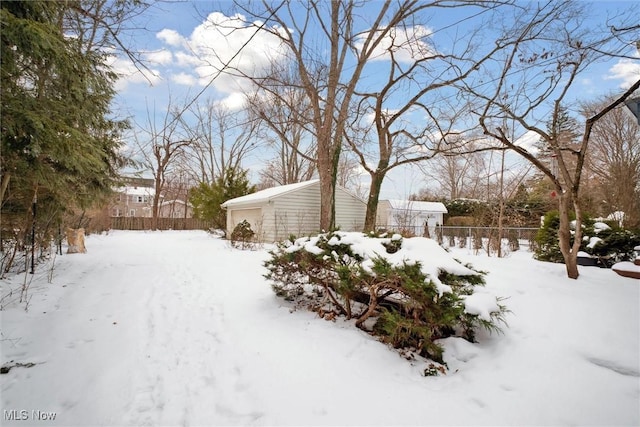 view of yard layered in snow