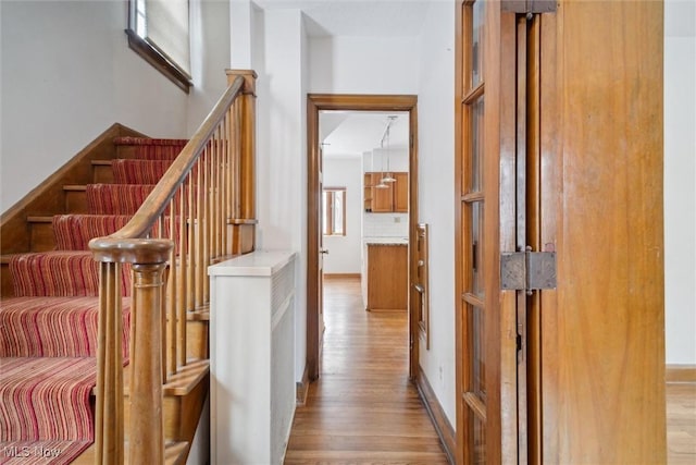 hallway with light wood-type flooring