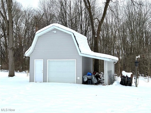 view of snow covered garage