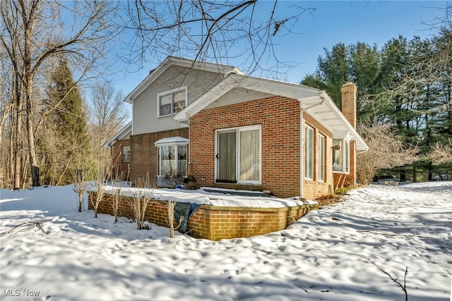 view of snow covered property