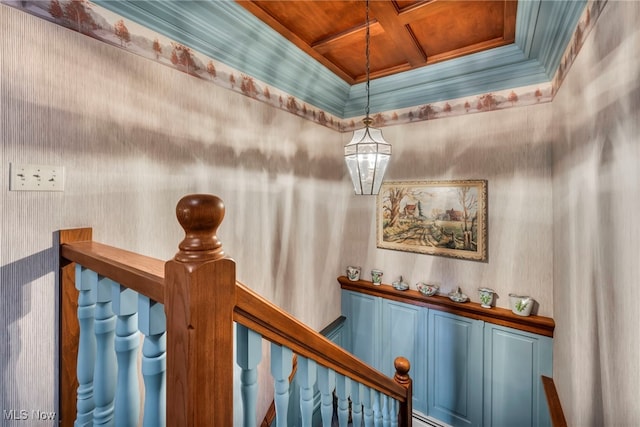 hall with wood ceiling, coffered ceiling, and crown molding