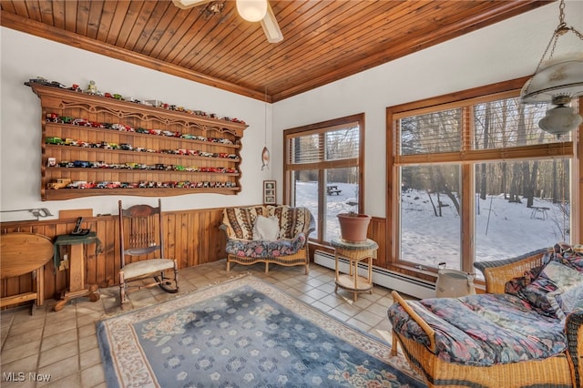 living area featuring wood ceiling, a baseboard radiator, crown molding, and light tile patterned flooring