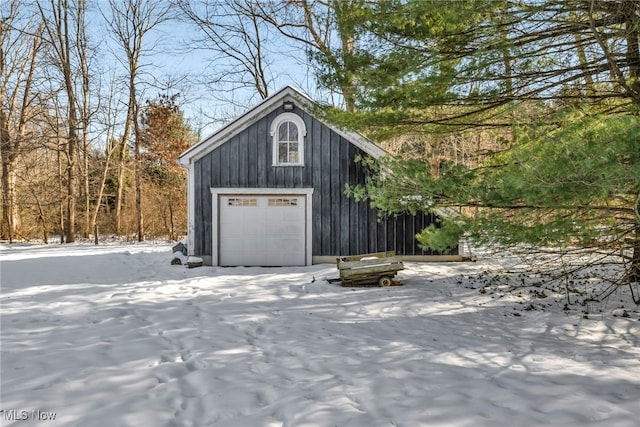 view of snow covered garage