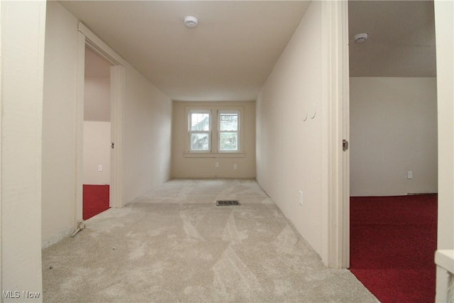 hallway with light carpet