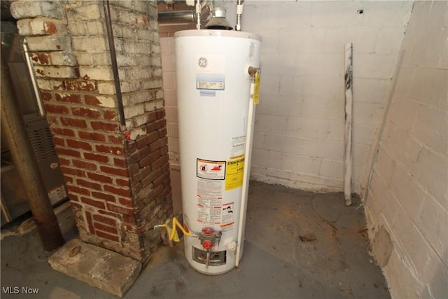 utility room featuring gas water heater