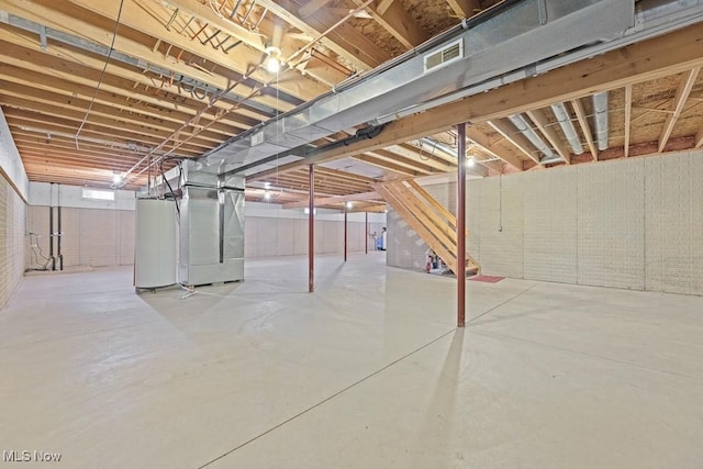 basement with heating unit and water heater