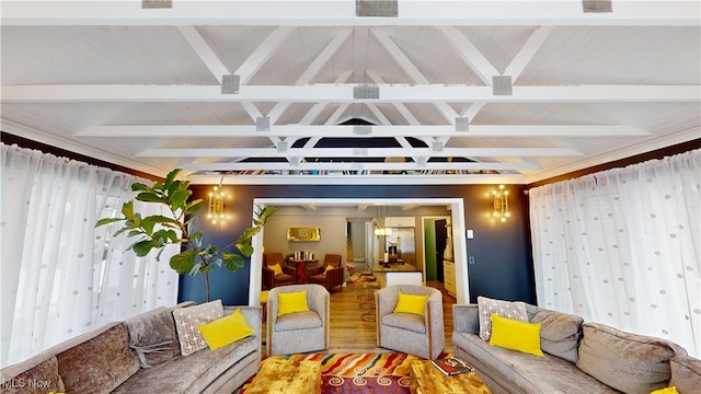 living room with beamed ceiling, wood-type flooring, and coffered ceiling