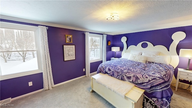 bedroom featuring light colored carpet and a textured ceiling