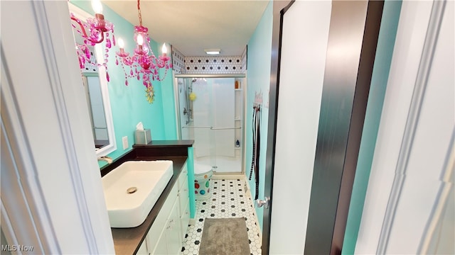 bathroom featuring vanity, a shower with shower door, and toilet