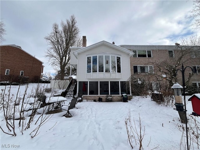 view of snow covered house