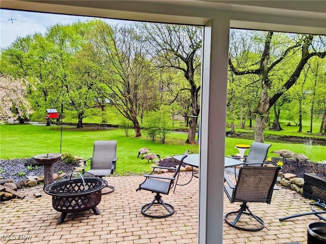 view of patio with an outdoor fire pit