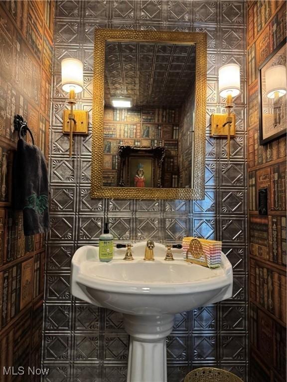 bathroom with tile walls