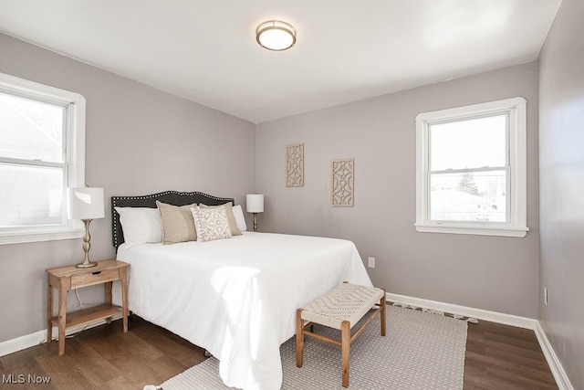 bedroom featuring dark wood-type flooring