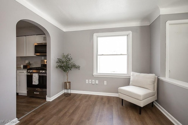 unfurnished room with dark hardwood / wood-style flooring