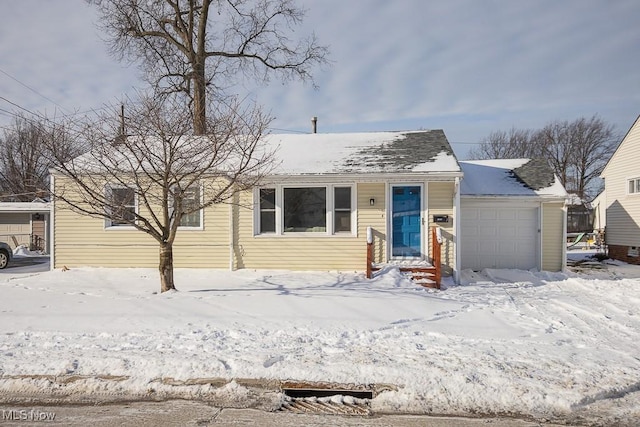 view of front of property with a garage