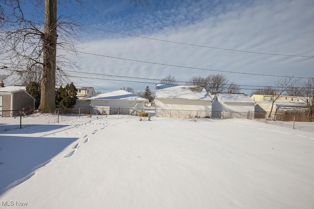 view of yard layered in snow