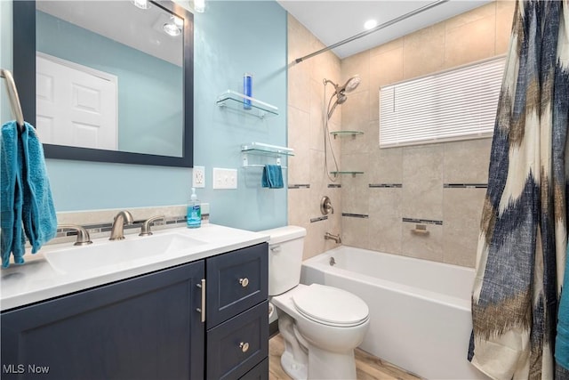 full bathroom with vanity, toilet, and shower / bath combo with shower curtain